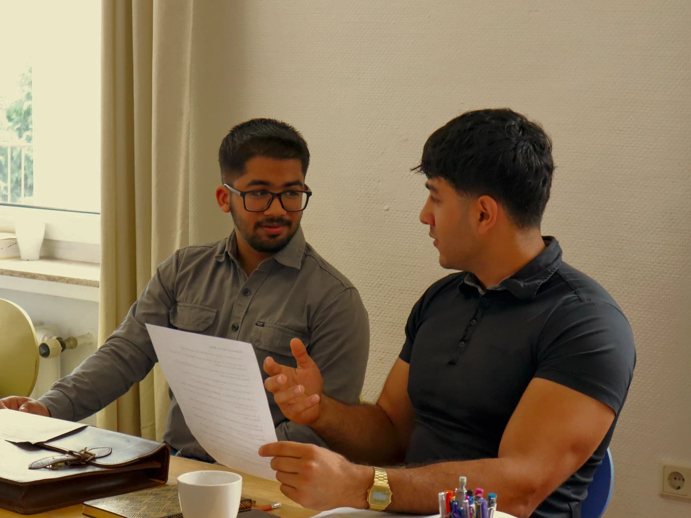 Two learners going through a document together